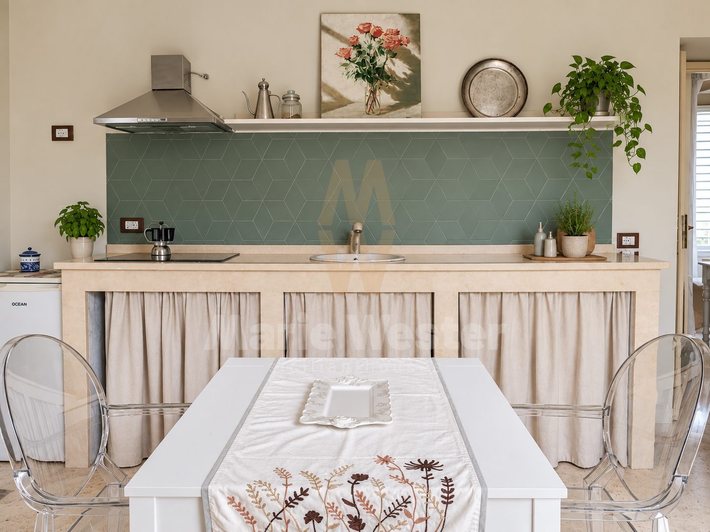 A kitchen with green hexagonal tiles, a moka pot, and curtain cabinets